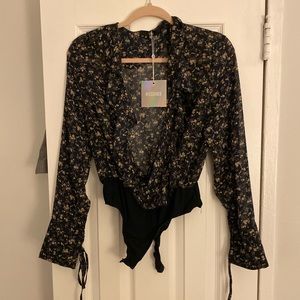 Black floral ruffled body suit